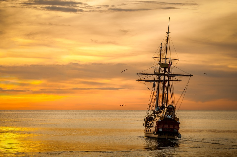 Photo of a ship at sunset