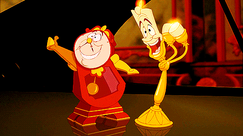 The clock and the candlestick from Beauty and the Beast celebrating.